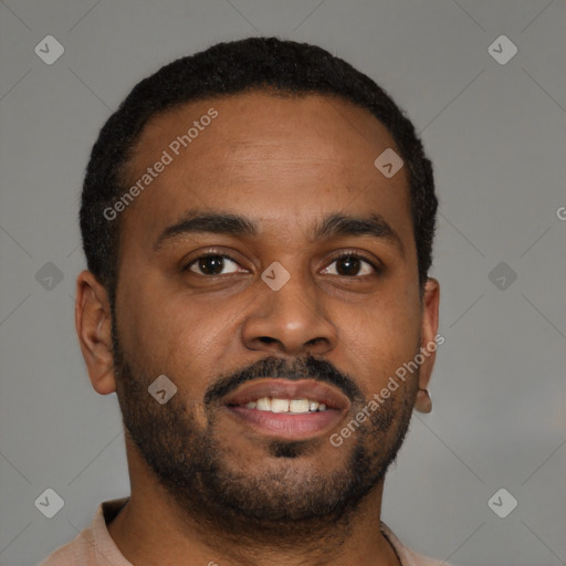 Joyful black young-adult male with short  brown hair and brown eyes