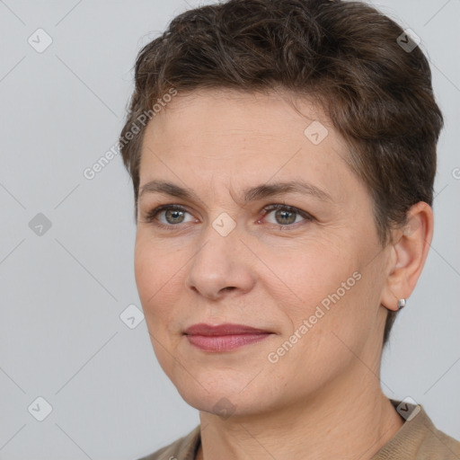 Joyful white adult female with short  brown hair and brown eyes