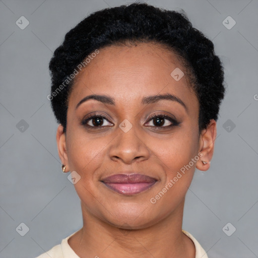 Joyful black adult female with short  black hair and brown eyes