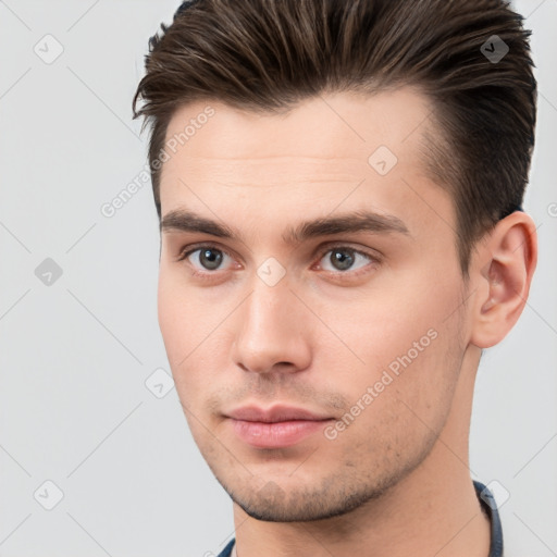 Neutral white young-adult male with short  brown hair and brown eyes