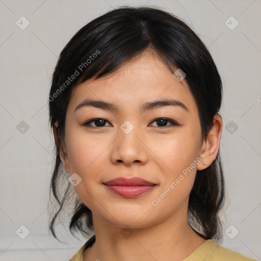 Joyful asian young-adult female with medium  black hair and brown eyes