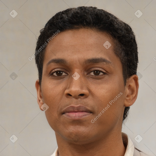 Neutral latino young-adult male with short  brown hair and brown eyes
