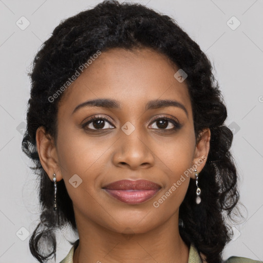 Joyful black young-adult female with long  brown hair and brown eyes