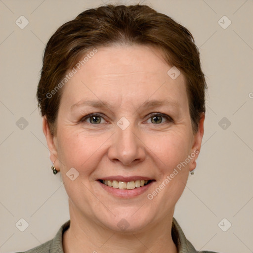 Joyful white adult female with short  brown hair and grey eyes