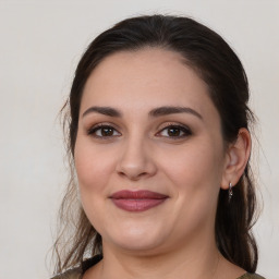 Joyful white young-adult female with medium  brown hair and brown eyes