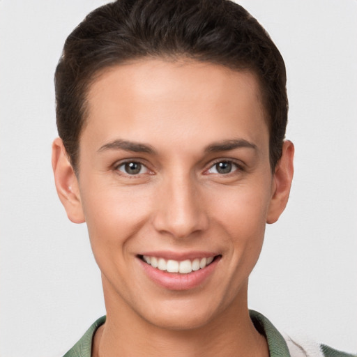 Joyful white young-adult female with short  brown hair and brown eyes