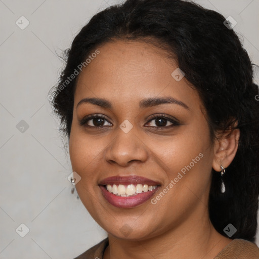 Joyful latino young-adult female with long  brown hair and brown eyes