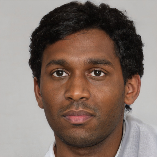 Neutral black young-adult male with short  brown hair and brown eyes