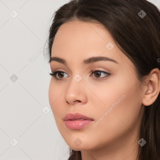 Neutral white young-adult female with long  brown hair and brown eyes