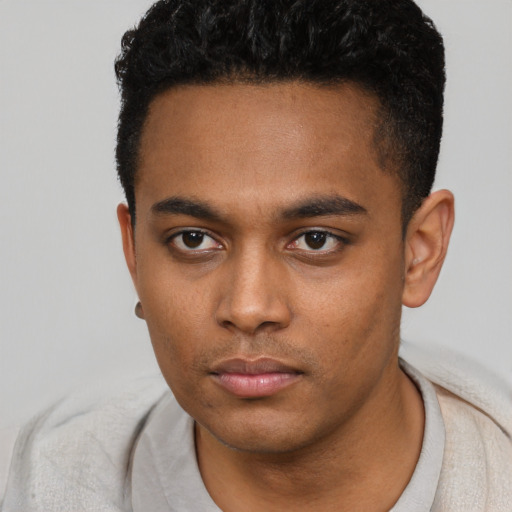 Neutral latino young-adult male with short  brown hair and brown eyes