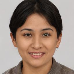 Joyful asian young-adult female with short  brown hair and brown eyes