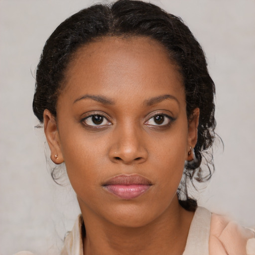 Neutral black young-adult female with medium  brown hair and brown eyes