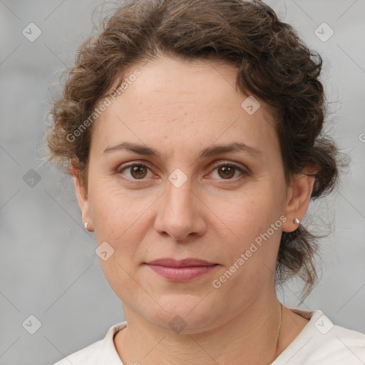 Joyful white adult female with short  brown hair and brown eyes