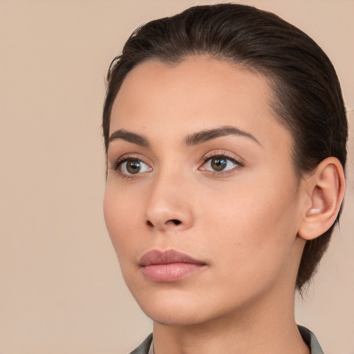 Neutral white young-adult female with medium  brown hair and brown eyes