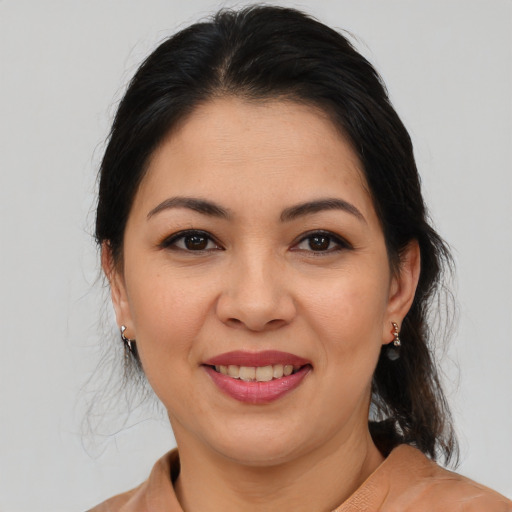 Joyful asian young-adult female with medium  brown hair and brown eyes