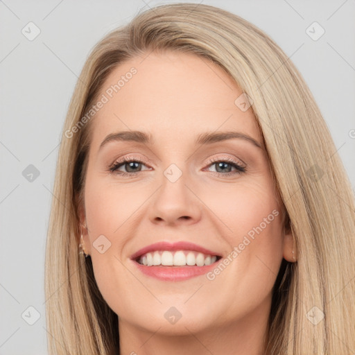 Joyful white young-adult female with long  brown hair and blue eyes