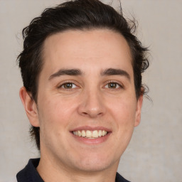 Joyful white young-adult male with medium  brown hair and brown eyes