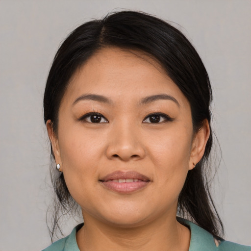 Joyful asian young-adult female with medium  black hair and brown eyes
