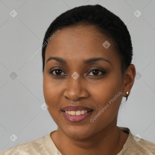 Joyful black young-adult female with short  black hair and brown eyes