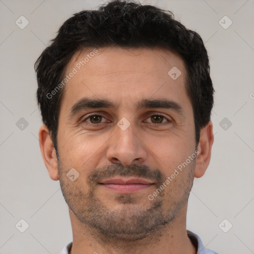 Joyful white adult male with short  black hair and brown eyes