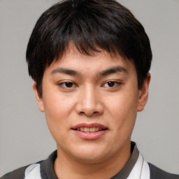 Joyful asian young-adult male with short  brown hair and brown eyes