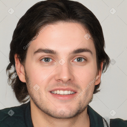 Joyful white young-adult male with medium  brown hair and brown eyes