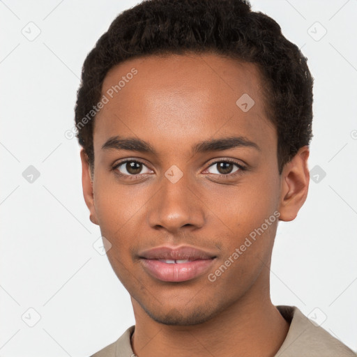 Joyful black young-adult male with short  brown hair and brown eyes