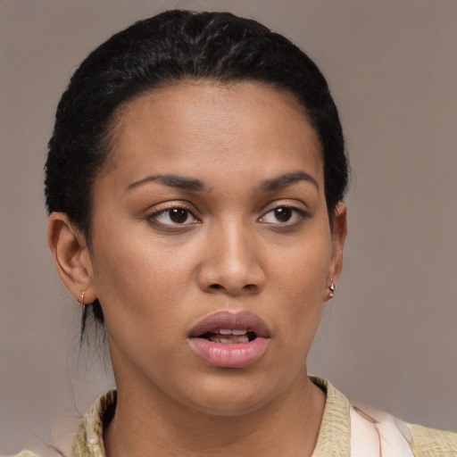 Joyful latino young-adult female with medium  black hair and brown eyes