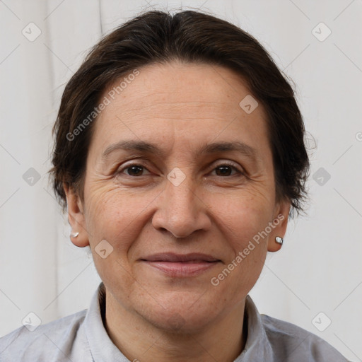 Joyful white adult female with short  brown hair and brown eyes