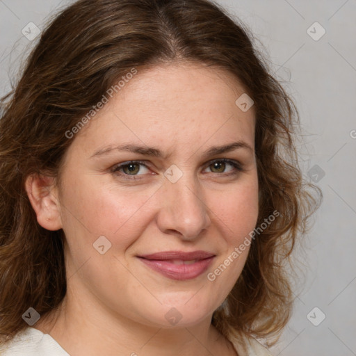 Joyful white young-adult female with medium  brown hair and green eyes