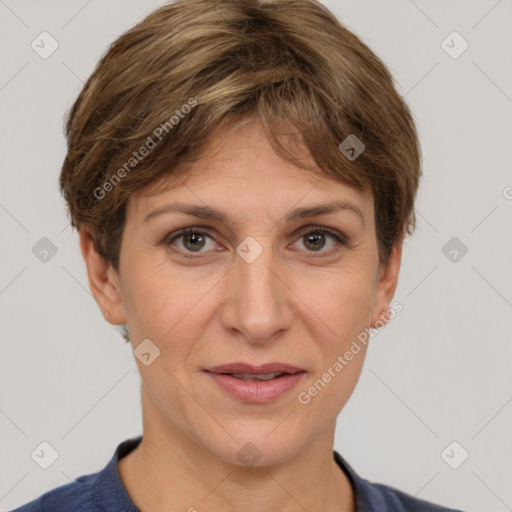 Joyful white adult female with short  brown hair and grey eyes