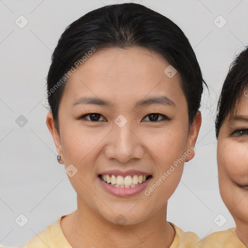 Joyful asian young-adult female with short  brown hair and brown eyes