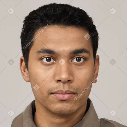 Neutral latino young-adult male with short  black hair and brown eyes