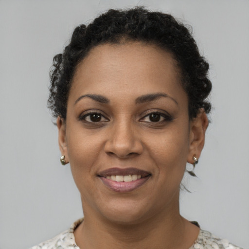 Joyful latino young-adult female with short  brown hair and brown eyes