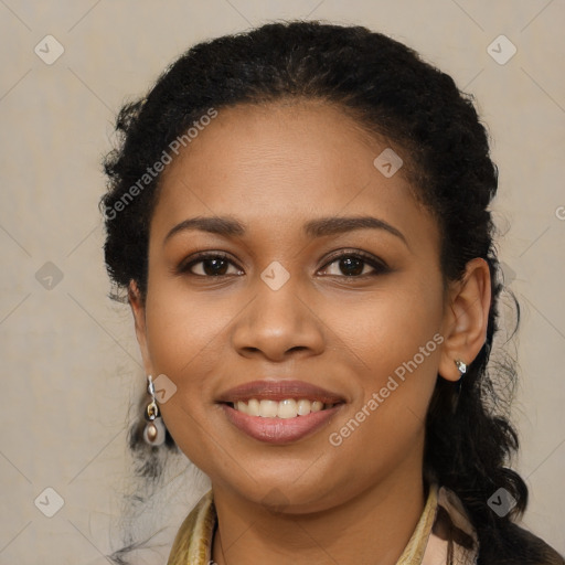 Joyful black young-adult female with long  brown hair and brown eyes