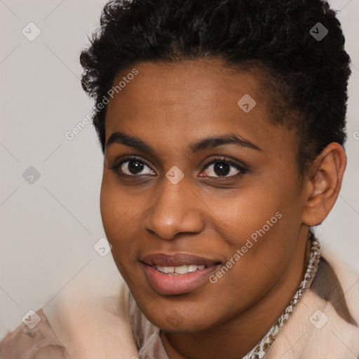 Joyful black young-adult female with short  brown hair and brown eyes