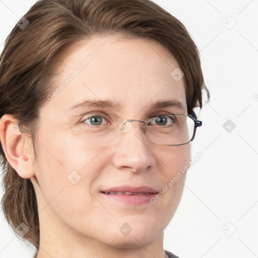 Joyful white adult female with medium  brown hair and grey eyes