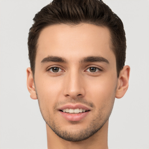 Joyful white young-adult male with short  brown hair and brown eyes