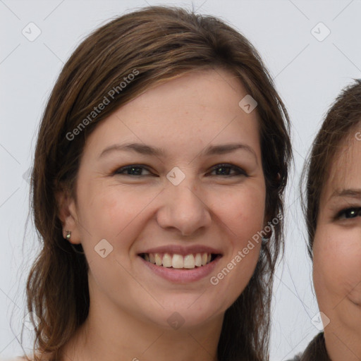 Joyful white young-adult female with long  brown hair and grey eyes