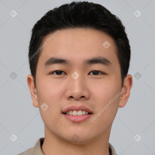 Joyful asian young-adult male with short  black hair and brown eyes