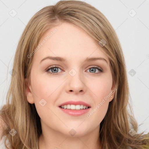 Joyful white young-adult female with long  brown hair and blue eyes