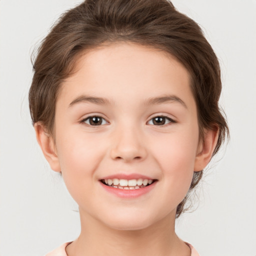 Joyful white child female with medium  brown hair and brown eyes