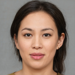 Joyful asian young-adult female with medium  brown hair and brown eyes