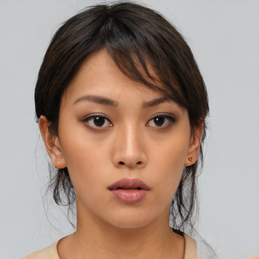 Neutral asian young-adult female with medium  brown hair and brown eyes