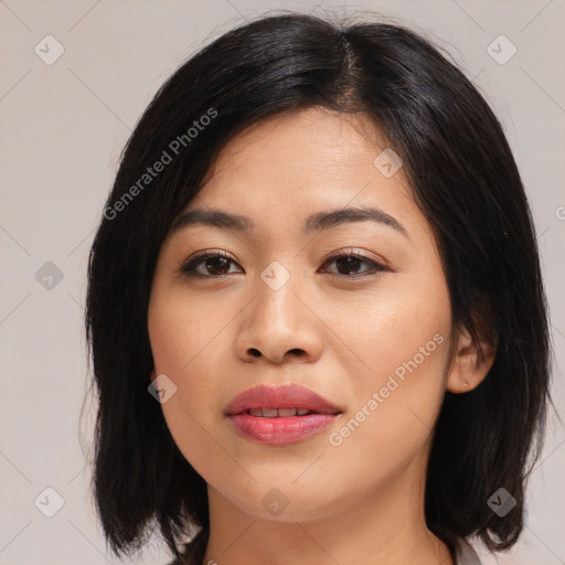 Joyful asian young-adult female with medium  brown hair and brown eyes