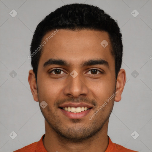 Joyful latino young-adult male with short  black hair and brown eyes