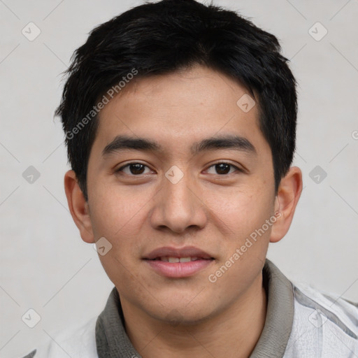 Joyful asian young-adult male with short  black hair and brown eyes