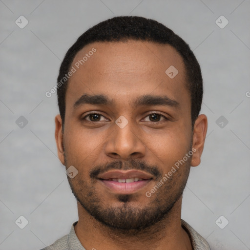 Joyful black young-adult male with short  black hair and brown eyes