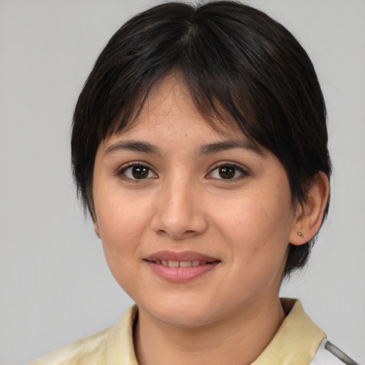 Joyful white young-adult female with medium  brown hair and brown eyes