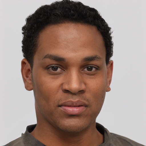 Neutral black young-adult male with short  black hair and brown eyes